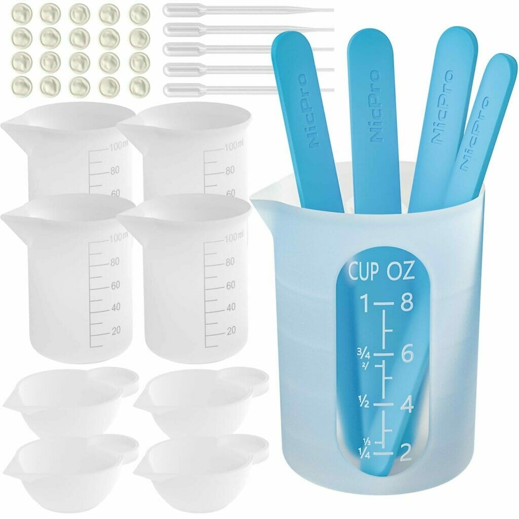 The Nicpro Silicone Resin measuring set includes both measuring cups and spoons for precise resin mixing.