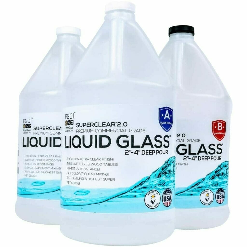 Three gallons of Super Clear liquid glass on a white background.