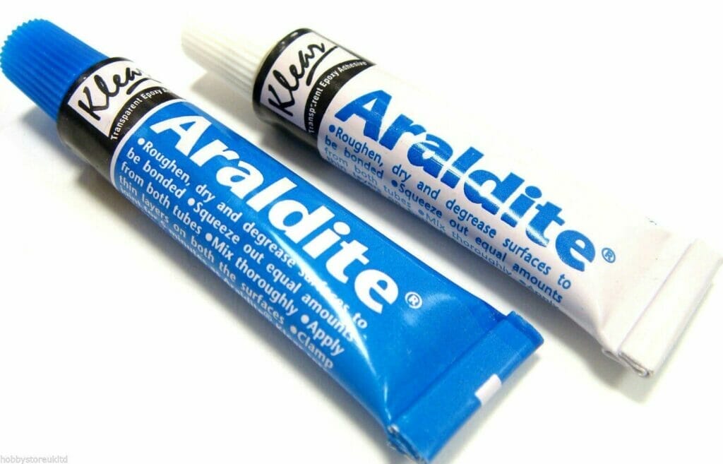Two tubes of Araldite epoxy on a white surface.