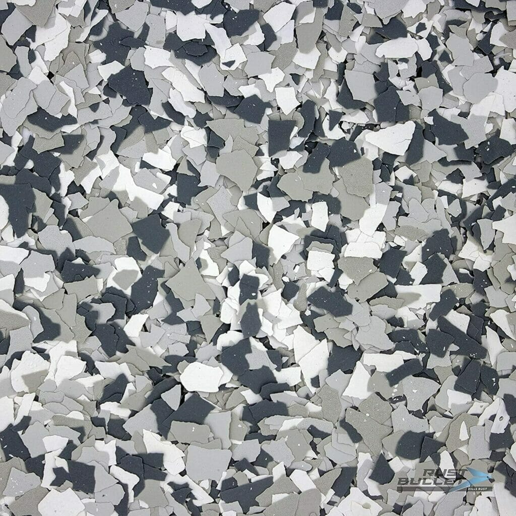 Description: A close up image of a gray and white tile floor with decorative concrete.