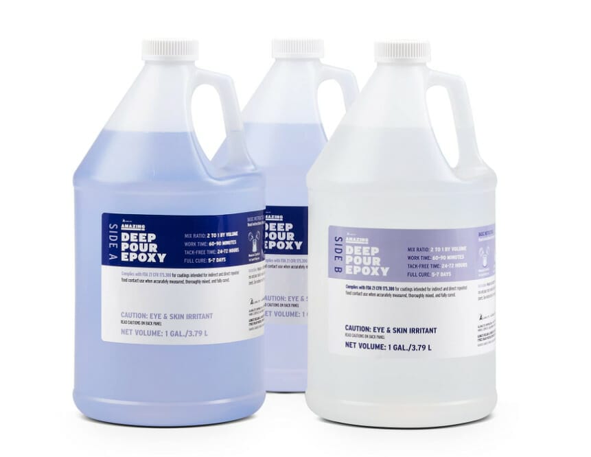 Three gallons of Alumilite deodorizer on a white background.