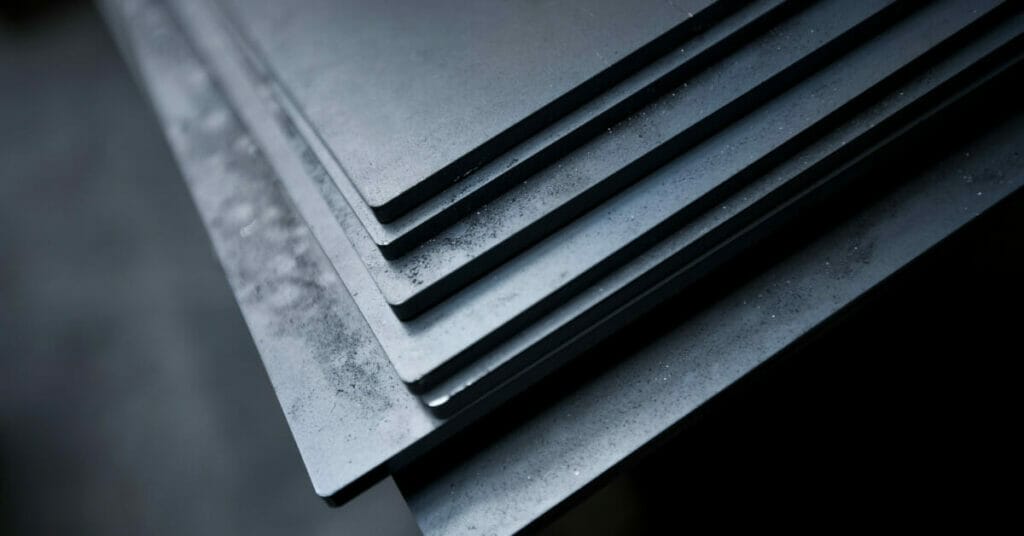 A close up of a stack of metal sheets bonded together with epoxy.